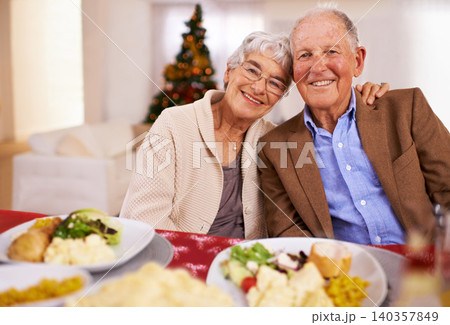 Christmas, smile and portrait of senior couple in home for dinner, bonding and happy together at party. Xmas, face and elderly man with woman at table, food and love of people on festive holiday Christmas, smile and portrait of senior couple in home for dinner, bonding and happy together at party. Xmas, face and elderly man with woman at table, food and love of people on festive holiday 140357849