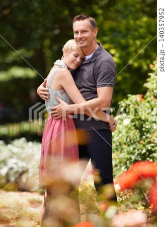 Hug, happy and couple in a park with love, trust and support, solidarity and security while bonding in nature. Commitment, care and people embrace on a field of flowers for spring romance or date Hug, happy and couple in a park with love, trust and support, solidarity and security while bonding in nature. Commitment, care and people embrace on a field of flowers for spring romance or date 140357952