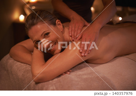 Woman, masseuse and portrait for wellness, relax and self care and back massage on table with smile. Female person, spa day and pampering to destress, peace and detox for calm lifestyle and happy Woman, masseuse and portrait for wellness, relax and self care and back massage on table with smile. Female person, spa day and pampering to destress, peace and detox for calm lifestyle and happy 140357976