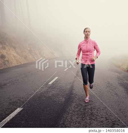 Nature, fitness and woman athlete running on mountain road for race, marathon or competition training. Sports, exercise and female person with cardio workout in misty outdoor woods or forest. Nature, fitness and woman athlete running on mountain road for race, marathon or competition training. Sports, exercise and female person with cardio workout in misty outdoor woods or forest. 140358016