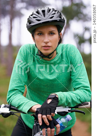 Nature, cardio and portrait of woman with bicycle for fitness in an outdoor park training for race or marathon. Sport, exercise and female athlete cyclist riding bike for workout in field or forest. Nature, cardio and portrait of woman with bicycle for fitness in an outdoor park training for race or marathon. Sport, exercise and female athlete cyclist riding bike for workout in field or forest. 140358067
