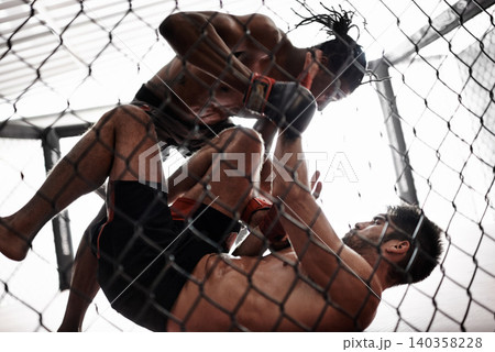 Punch, cage and men sparring for kickboxing competition, challenge and fitness with fight sports in gym. Boxing match, strong fighter and knockout with exercise, practice and power in battle together 140358228