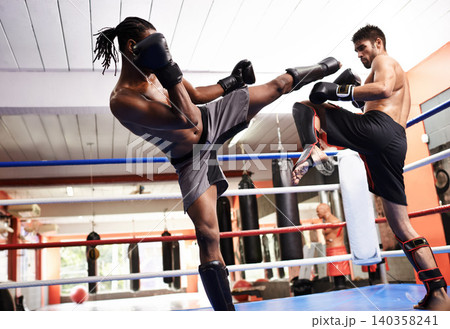Men, kickboxing and performance for fight in ring, fitness and topless for exercise and workout. People, action and practice for challenge or match, training and combat for competition in sports Men, kickboxing and performance for fight in ring, fitness and topless for exercise and workout. People, action and practice for challenge or match, training and combat for competition in sports 140358241