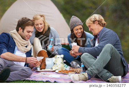 Nature, camping and friends on picnic with food laughing, talking and bonding on vacation. Happy, travel and group of people eating lunch in outdoor field, park or forest on holiday or weekend trip. Nature, camping and friends on picnic with food laughing, talking and bonding on vacation. Happy, travel and group of people eating lunch in outdoor field, park or forest on holiday or weekend trip. 140358277