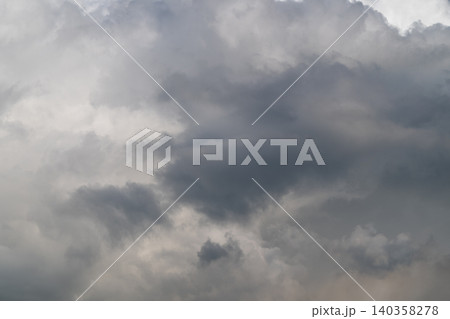 Layered sky formations indicating movement. Dynamic volumetric clouds suggestive of motion. Threedimensional cloud structures displaying turbulence and variety in scale 140358278