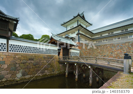 Kanazawa, Japan - Oct 6 2024, panoramic view of facade of Kanazawa Castle with the moat in the foreground, on a cloudy day, without people, at daytime, Kanazawa, Japan Kanazawa, Japan - Oct 6 2024, panoramic view of facade of Kanazawa Castle with the moat in the foreground, on a cloudy day, without people, at daytime, Kanazawa, Japan 140358370