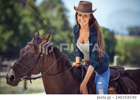 Woman, portrait and horse or ranch environment in nature as equestrian for adventure,, training or cowboy hat. Female person, stallion and western cowgirl in Texas or countryside, outdoor or rural Woman, portrait and horse or ranch environment in nature as equestrian for adventure,, training or cowboy hat. Female person, stallion and western cowgirl in Texas or countryside, outdoor or rural 140358540