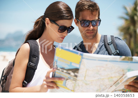 Couple, map and search on travel by beach, mountains or idea to check direction for help on vacation. Woman, man and chart for location, landmark or reading with thinking on holiday by ocean in Italy 140358653