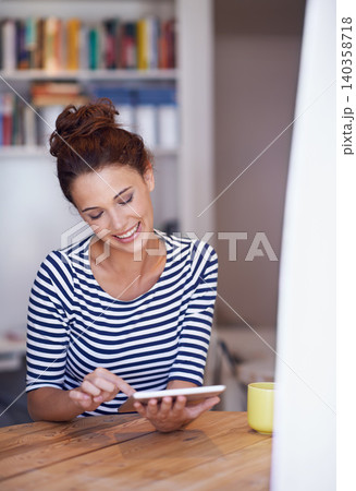 Relax, smile and woman in home office with tablet, search or scroll on social media for business networking. Communication, remote work and girl at table with digital app for freelance, email or post Relax, smile and woman in home office with tablet, search or scroll on social media for business networking. Communication, remote work and girl at table with digital app for freelance, email or post 140358718