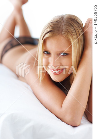 Woman, bed and topless or lingerie with smile in bedroom at home, confidence and satisfied with body. Fashion, female person and house with lace underwear or happiness for comfort and valentines day. Woman, bed and topless or lingerie with smile in bedroom at home, confidence and satisfied with body. Fashion, female person and house with lace underwear or happiness for comfort and valentines day. 140358755