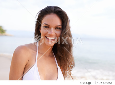 Beach, nature and portrait of woman for travel on tropical vacation, adventure or holiday. Happy, smile and female person with positive attitude by ocean on outdoor summer weekend trip by island. 140358968