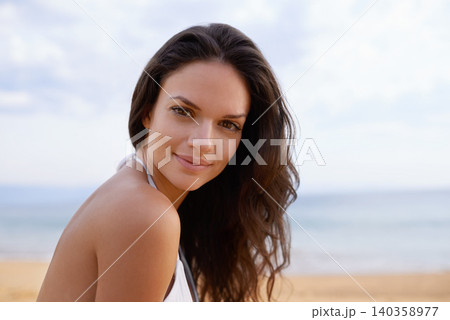 Beach, smile and portrait of woman in nature on tropical vacation, adventure or holiday. Happy, travel and young female person with positive attitude by ocean on summer weekend trip by island. 140358977