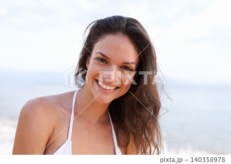 Beach, nature and portrait of woman for travel, vacation or adventure on tropical island. Happy, smile and young female person with positive and confident attitude by ocean on summer weekend trip. Beach, nature and portrait of woman for travel, vacation or adventure on tropical island. Happy, smile and young female person with positive and confident attitude by ocean on summer weekend trip. 140358978