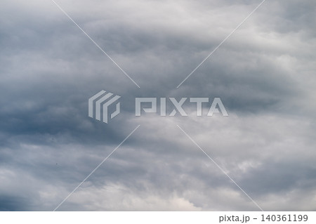 Soft overcast sky with layered clouds, muted gray tones and subtle texture, gentle gradients create peaceful mood for backgrounds, web banners, nature and weather concepts 140361199