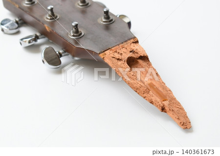part of broken wood acoustic guitar isolated on white background part of broken wood acoustic guitar isolated on white background 140361673