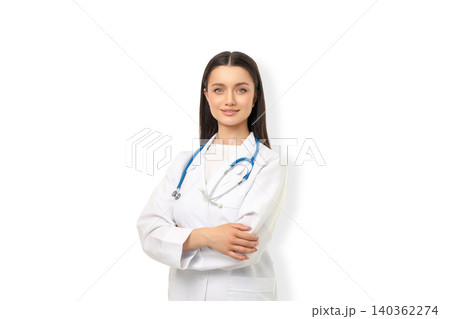 A female doctor smiles gently with arms crossed, isolated, PNG A female doctor smiles gently with arms crossed, isolated, PNG 140362274