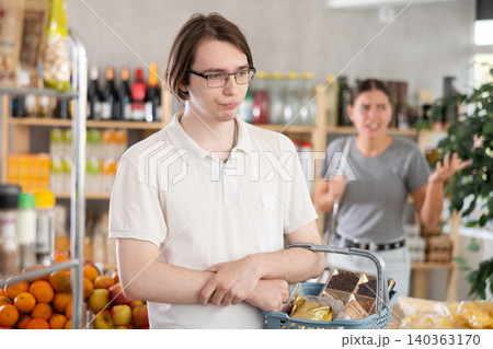 quarreling in a store 140363170