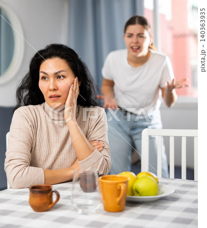 Young female quarreling at home Young female quarreling at home 140363935