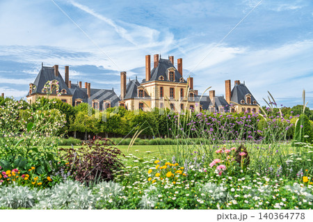 Fontainebleau Castle, France Scenic view of historic palace and formal gardens in summer 140364778