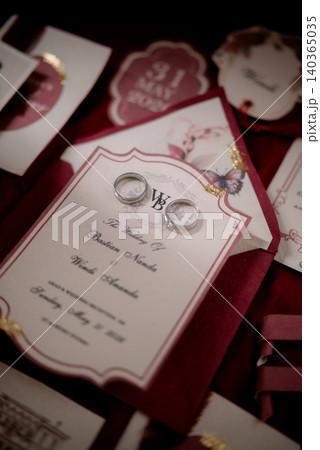 Elegant wedding invitations and business cards with a Burgundy theme. 140365035