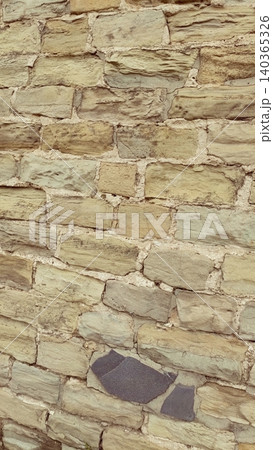 Old Beige Stone Wall Texture Rustic Masonry Background with Natural Rocks and Mortar 140365326