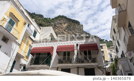 Facades of famous town of Amalfi, located on the Amalfi Coast, with its azure sea and beautiful colorful cliffside houses. Facades of famous town of Amalfi, located on the Amalfi Coast, with its azure sea and beautiful colorful cliffside houses. 140365879