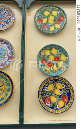 Traditional ceramic plates in souvenir shop in Amalfi at Italy Traditional ceramic plates in souvenir shop in Amalfi at Italy 140365886