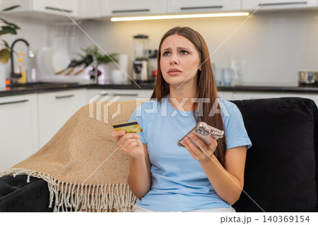 Young woman tries payment with smartphone and credit card gets insufficient funds card blocked fraud Young woman tries payment with smartphone and credit card gets insufficient funds card blocked fraud 140369154