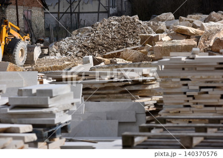 Stacked limestone slabs and tiles Stacked limestone slabs and tiles 140370576