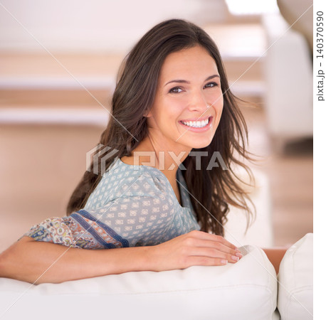Portrait, sofa or happy woman in home to relax in living room on holiday in hotel, house or apartment. Face, couch or female person with peace, wellness or confidence on break to rest for alone time Portrait, sofa or happy woman in home to relax in living room on holiday in hotel, house or apartment. Face, couch or female person with peace, wellness or confidence on break to rest for alone time 140370590