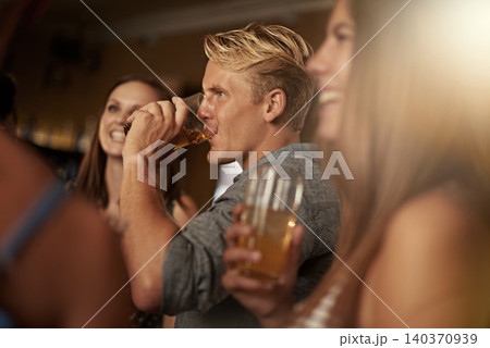 Friends, man and happiness in pub with beer for happy hour, relax or social event with window view. Diversity, people and drinking alcohol in restaurant or club with smile for bonding and celebration Friends, man and happiness in pub with beer for happy hour, relax or social event with window view. Diversity, people and drinking alcohol in restaurant or club with smile for bonding and celebration 140370939
