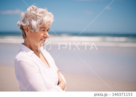 Elderly woman, smile and relax on beach for summer, happiness and peace in outdoors. Mature female person, retirement and enjoying on vacation journey, ocean and water for weekend or holiday Elderly woman, smile and relax on beach for summer, happiness and peace in outdoors. Mature female person, retirement and enjoying on vacation journey, ocean and water for weekend or holiday 140371153