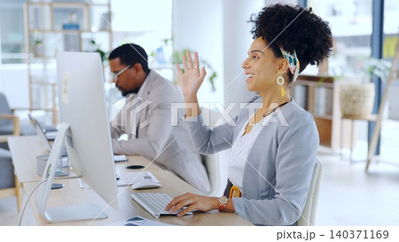 Business woman, video call and wave at computer in office for meeting, webinar or communication. African professional, smile and hello in online conference, welcome or agent greeting in zoom chat Business woman, video call and wave at computer in office for meeting, webinar or communication. African professional, smile and hello in online conference, welcome or agent greeting in zoom chat 140371169