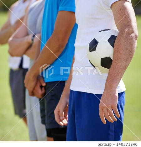 Field, team and hand holding soccer ball for game, training and competition with fitness. People, group and football player with anthem, captain or leader for sports, exercise or workout for contest 140371240