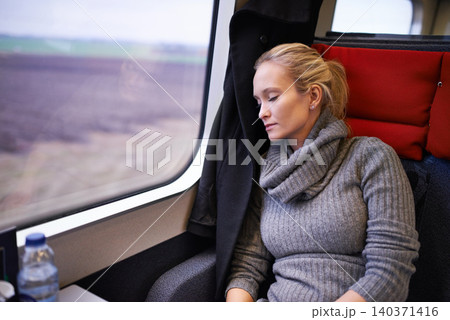 Woman, train and sleep with travel or relax journey for holiday destination for tired, transportation or resting. Female person, window and commute in Canada with nap for peace, comfortable or trip Woman, train and sleep with travel or relax journey for holiday destination for tired, transportation or resting. Female person, window and commute in Canada with nap for peace, comfortable or trip 140371416