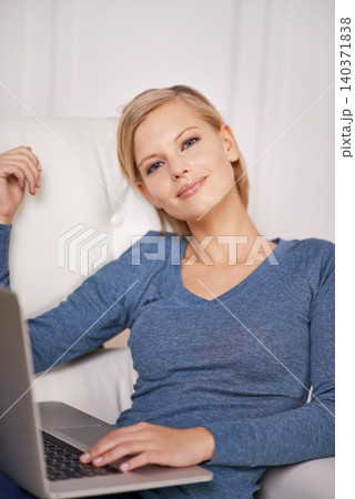 Smile, laptop and portrait of woman on sofa typing online email or writing blog on internet. Happy, technology and female freelancer working on research for creative project with computer at home. Smile, laptop and portrait of woman on sofa typing online email or writing blog on internet. Happy, technology and female freelancer working on research for creative project with computer at home. 140371838