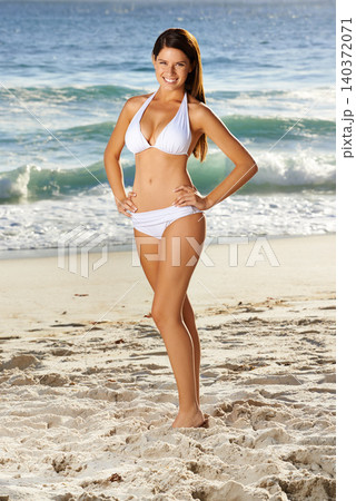 Woman, portrait and happy on sand at beach in summer for travel, holiday or vacation in Maldives with relax or waves. Person, tourist and face with bikini or smile outdoor in nature for fun adventure Woman, portrait and happy on sand at beach in summer for travel, holiday or vacation in Maldives with relax or waves. Person, tourist and face with bikini or smile outdoor in nature for fun adventure 140372071
