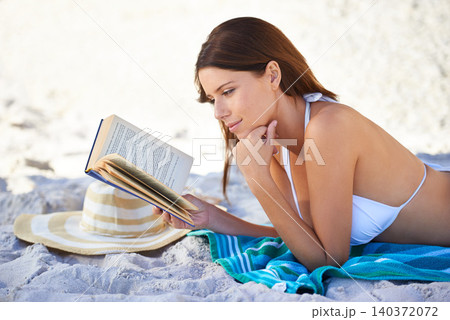 Beach, shade and woman reading book to relax in summer on towel, sand and outdoor in nature. Girl, smile and happiness in bikini at sea, vacation and hat for sun, weekend and novel for person Beach, shade and woman reading book to relax in summer on towel, sand and outdoor in nature. Girl, smile and happiness in bikini at sea, vacation and hat for sun, weekend and novel for person 140372072