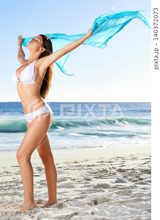 Beach, bikini and woman free with fabric in summer, sand and outdoor in nature for vacation. Girl, calm and peace in destination at sea, holiday and Maldives for sun, weekend and joy of a person Beach, bikini and woman free with fabric in summer, sand and outdoor in nature for vacation. Girl, calm and peace in destination at sea, holiday and Maldives for sun, weekend and joy of a person 140372073