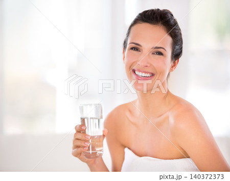 House, happy woman or skincare portrait for drinking water in morning routine for hydration in living room. Beauty, healthy female person or smile with cosmetic for natural glow, detox and confidence House, happy woman or skincare portrait for drinking water in morning routine for hydration in living room. Beauty, healthy female person or smile with cosmetic for natural glow, detox and confidence 140372373