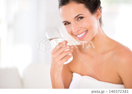 Home, happy woman or skincare portrait for drinking water in morning routine for hydration in living room. Female person, healthy lady and smile with cosmetic for natural glow, detox and confidence Home, happy woman or skincare portrait for drinking water in morning routine for hydration in living room. Female person, healthy lady and smile with cosmetic for natural glow, detox and confidence 140372381