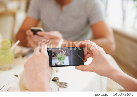 Cafe, picture and couple with cellphone, screen and connection with Valentines day and photograph. Date, man and woman with smartphone and digital app for memory and romance with restaurant or luxury 140372679