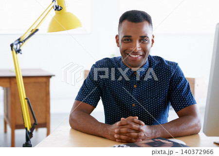 Young businessman, portrait and confident in office by desk, consultant and creative in fashion. Happy, black man or positive face of designer in co working space or about us for ambition in company Young businessman, portrait and confident in office by desk, consultant and creative in fashion. Happy, black man or positive face of designer in co working space or about us for ambition in company 140372966