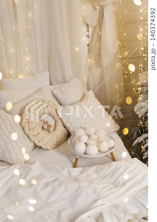 Magical White Bedroom Decor with Twinkling Christmas Lights and Wreath Magical White Bedroom Decor with Twinkling Christmas Lights and Wreath 140374392