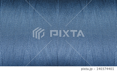Close-up texture of Blue sewing threads on a spool Close-up texture of Blue sewing threads on a spool 140374401