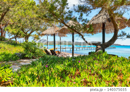 Breathtaking view of beach of Santa Giulia resort. Breathtaking view of beach of Santa Giulia resort. 140375035
