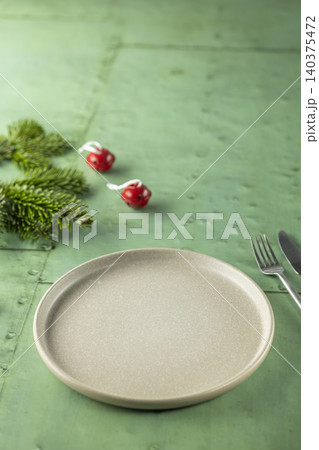 Empty plate setting for festive Christmas holiday dinner Empty plate setting for festive Christmas holiday dinner 140375472