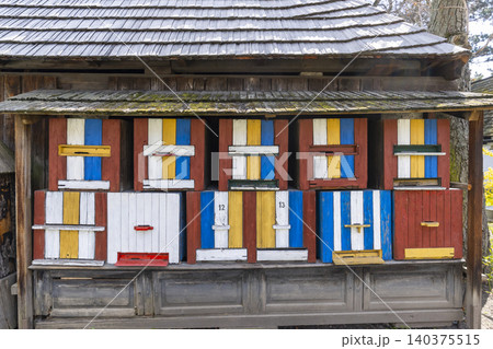 Colorful traditional beehives lined up in Prerov nad Labem Czechia Colorful traditional beehives lined up in Prerov nad Labem Czechia 140375515