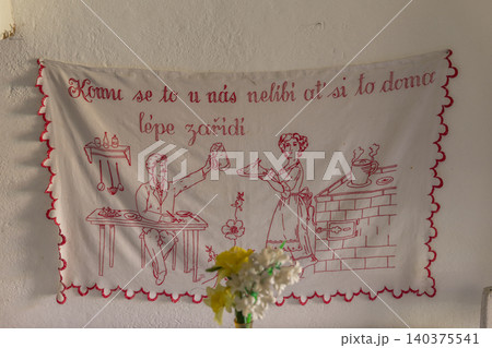 Czech traditional kitchen embroidery featuring domestic proverb Czech traditional kitchen embroidery featuring domestic proverb 140375541
