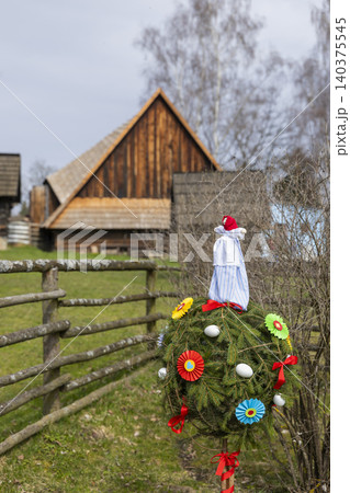 Morana effigy decorating a Czech folk house Morana effigy decorating a Czech folk house 140375545